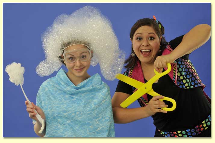 Color picture of the Bubble Lady with a smiling volunteer for the Soap Hairdo routine.