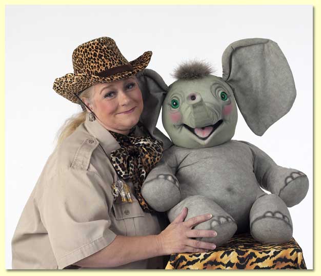Picture of Margaret Clauder as Masai Maggie with Sneezy the elephant puppet.