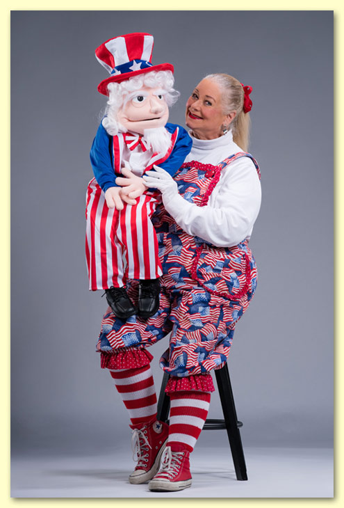Photograph of Patriotic Patty with her Uncle Sam puppet.
