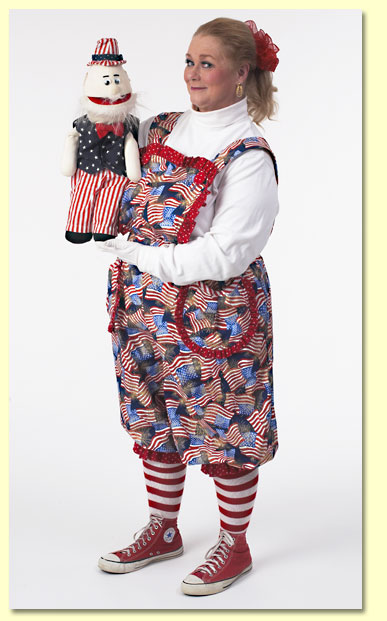 Picture of Margaret Clauder dressed as Patriotic Patty with the Uncle Sam puppet.
