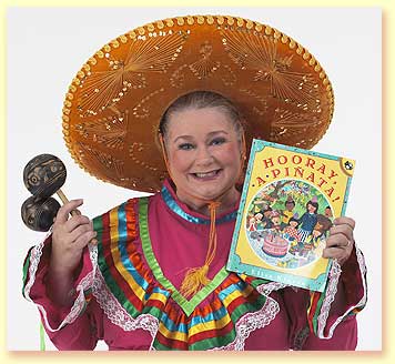 Thumbnail photograph of Margaret Clauder as Senorita Margarita holding the book Hooray a Pinata, and maracas.
