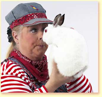 Photograph of Margaret Clauder as Engineer Maggie, holding a white rabbit.