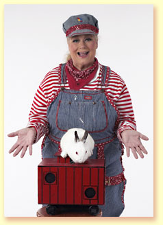 Photograph of Margaret Clauder as Engineer Maggie with her friend, a bunny.
