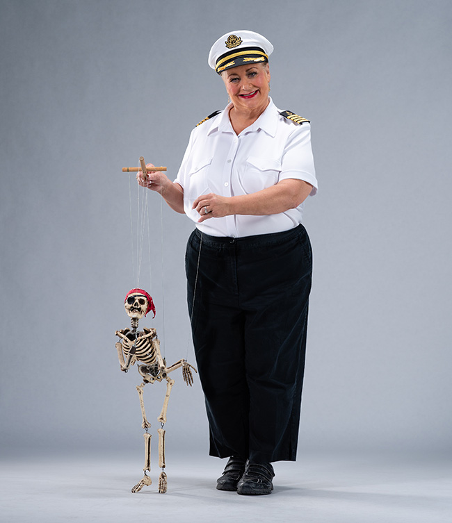 Captain Maggie behind her puppet stage