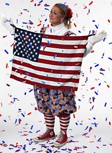 Picture of Margaret Clauder as Patriotic Patty, holding a U.S. flag.