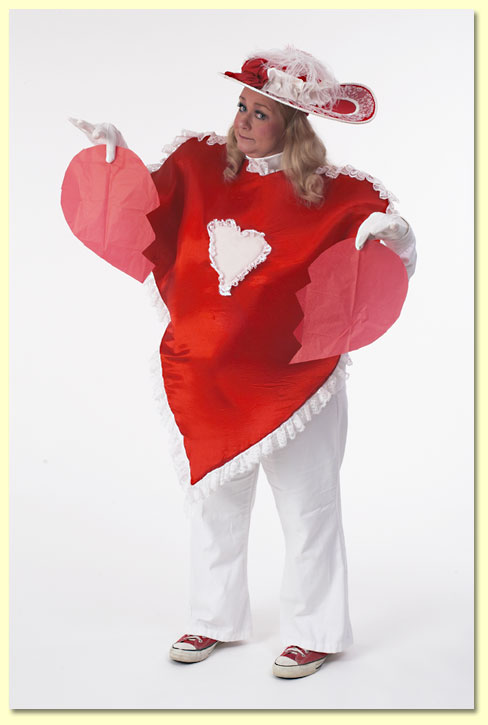 Photo of Margaret Clauder's character Lovey Dovey holding a torn paper heart.