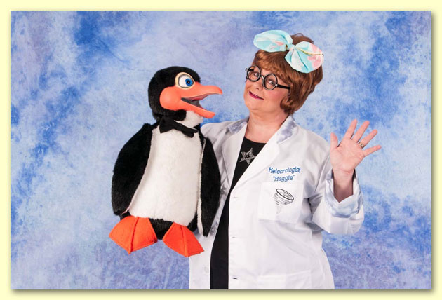Large photograph of Meteorologist Maggie with Chilly the Penguin